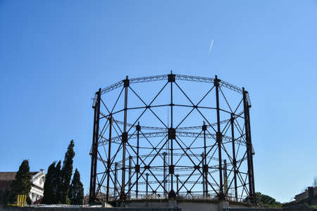a round metal scaffolding and a plane in the sky in Venice, Italy, March, 2021のeditorial素材
