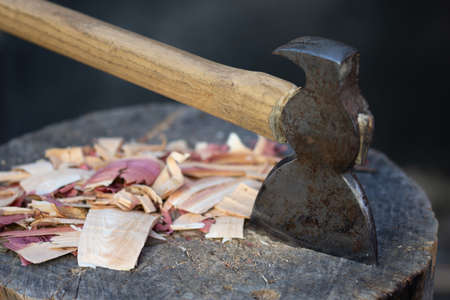 an ax on a wooden logの写真素材