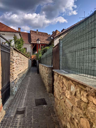 narrow stone  passage in Bistrita,Romania ,august 2021