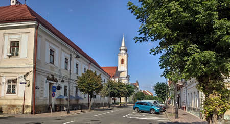 Romania  ,Bistrita ,Gheorghe Sincai Street,   2021, august ,Roman Catholic Church and  Evangelical Churchのeditorial素材