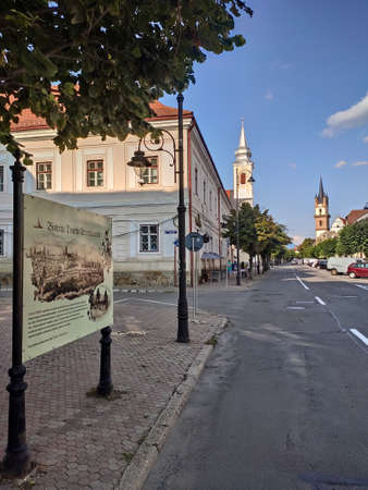 Romania  ,Bistrita ,Gheorghe Sincai Street,   2021, august ,Roman Catholic Church and  Evangelical Churchのeditorial素材