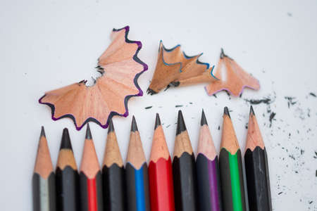 sharp pencils on a white background and a black sharpenerの写真素材