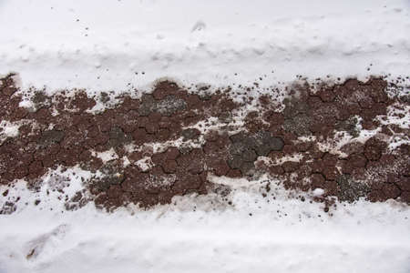 salt on the sidewalk to melt the snow  in December 2021, Bistrita, Romaniaのeditorial素材