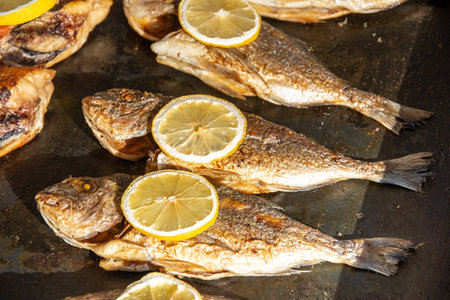 Grilled carp fish ,Dorada (Sparus aurata) with lemon in Bistrita ,Romania
