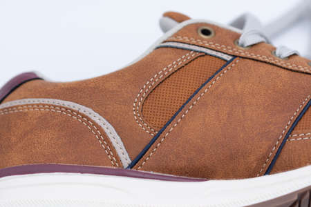 brown sneakers with fine stitching and perforated designの写真素材