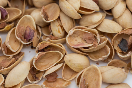 Pile of pistachio shells isolated on white background
