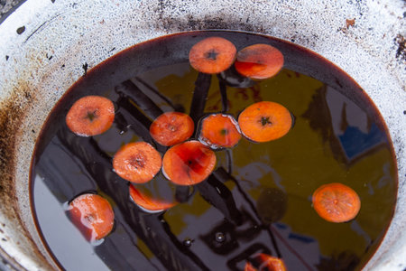 Traditional Christmas mulled wine hot drink. red wine with cloves, nutmeg,cinnamon and orange