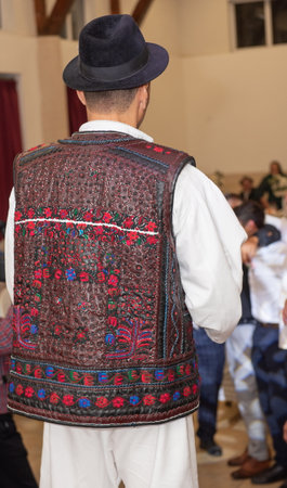 Traditional leather outfit decorated with flowers from the Maramures area, Romania 2024の写真素材