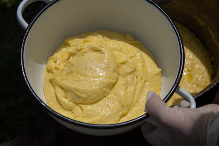 The method of preparation of BalmoÅului, BalmoÈ mÄmÄliga is boiled, in jintita (or jintuial), with butter and sheep cream. Specialty in Romania, Ardeal, Bistrita 2024の写真素材