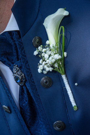 Wedding Flowers â€“ Pink Grooms Buttonholes on a Blue Suit