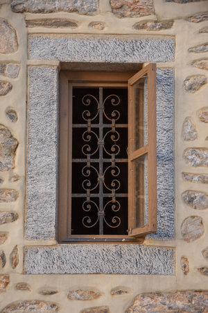 Windows with iron bars at the Romanian Prodromou Skete on Mt. Athos,Greece, February, 2023