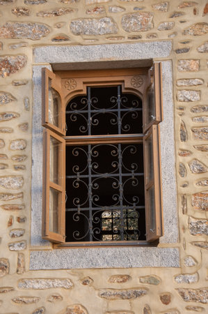 Windows with iron bars at the Romanian Prodromou Skete on Mt. Athos,Greece, February, 2023