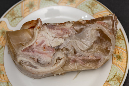 Pieces of pork prepared in Romania, Piftie, cold, drum -Sliced ââpork meat products, traditional Romanian food at winter Christmas market, Sausages and cold cuts, piftie, tobaの写真素材