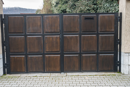The image shows a paneled sliding gate, likely used as a driveway or entrance gate for a property.の写真素材