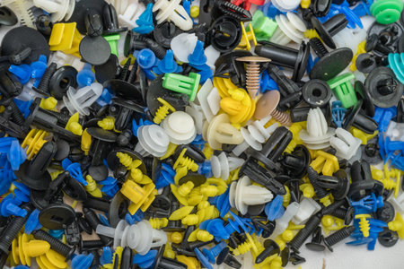 The image displays a collection of universal car retainer clips and fasteners, also commonly known as bumper clips or trim clipsの写真素材