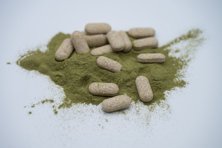 Moringa powder and organic capsules on white backgroundの写真素材