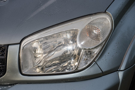 shiny headlights on a gray   carの写真素材