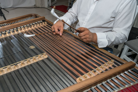 a person playing a cimbalom, also known as a hammered dulcimer. It is a string instrument popular in Romania,2025の写真素材