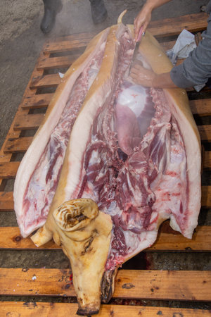 Cutting a pig into pieces before Christmas, winter holidays in Romaniaの写真素材