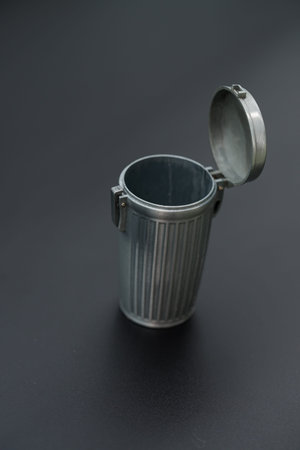 miniature metal trash can, also marketed as a dollhouse accessory or portable ashtray.の写真素材
