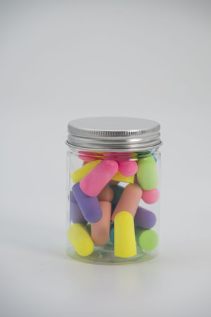 soft, multi-colored foam earplugs. 
Made from super-soft, non-toxic polyurethane foam. 
Offer high noise reduction ratings (NRR) typically between 28 to 32 decibels (dB).の写真素材