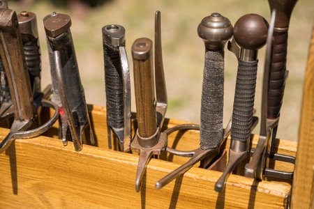 a collection of swords used for historical reenactment. Replicas of medieval and Viking sword models, intended for simulating battles or demonstrations.