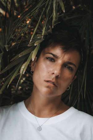Portrait of an attractive and beautiful serious woman with short hair looking at the camera...