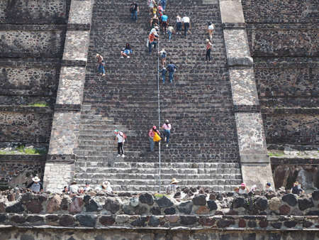 Tourists climbing on Teotihuacan pyramidsの写真素材