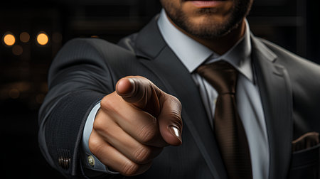 Close up of businessman pointing with finger at camera. Business success conceptの素材