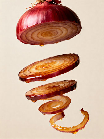 Sliced red onion levitate in the air on a gray backgroundの素材