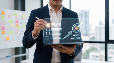 Businessman using digital tablet and writing on virtual screen. business conceptの素材