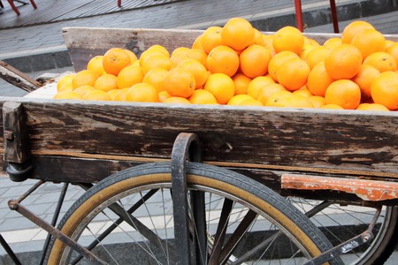 a chart full of oranges in a french market at Bordeauxの写真素材