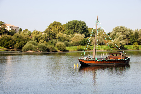 a boat on river dordogne at bergerac, aquitain, franceの写真素材