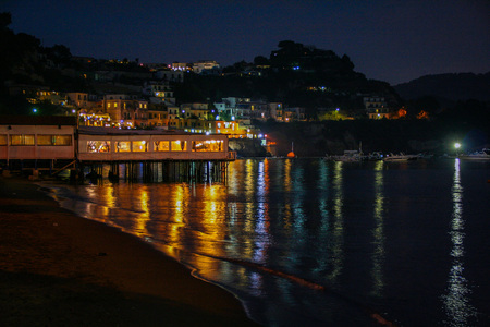 AT BAIA - POZZUOLI - NAPLES - ITALY ON 09/25/2016 - The little old port of Baia in Naples province, at night. Italyのeditorial素材