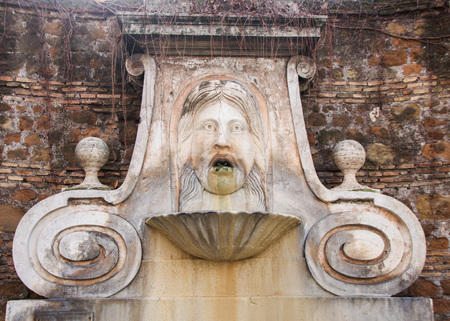Fountain in Via Giulia, known as mascherone, representing a human faceの写真素材