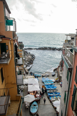 At Riomaggiore, Italy - On mrch, 31, 2018 - The little marina of Riomaggiore, one of the most picturesque village in Cinque Terre in Liguria region, Italyの写真素材