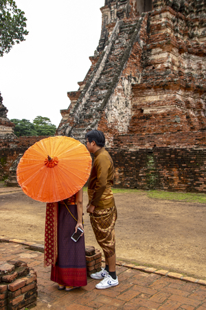 At Ayutthaya - Thailand - On august 2018 -  girl in traditional thai clothes in the Buddhist temple called Wat Chaiwatthanaramのeditorial素材