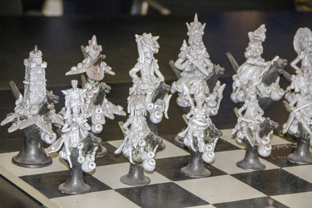 at Marostica - Italy - on october 2018 - traditional hancrafted whistlers, named cuchi,  in form of chess pieces on a chess boardの写真素材