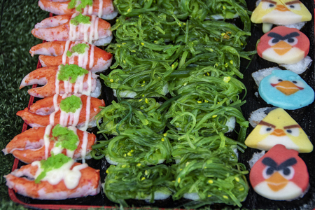 variety of sushi in a stall  as street food served in the night market of Kanchanaburi in Thailandのeditorial素材