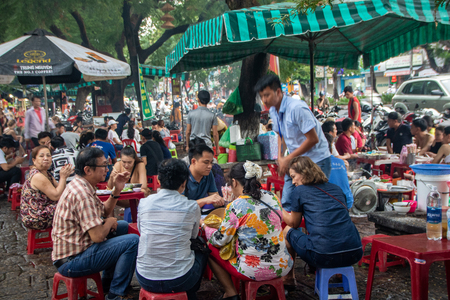 Hue City - Vietnam - on august 2019 - people eating in traditional street food restaurantのeditorial素材