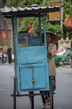 At Hue - Vietnam - On august 2019 - woman on a bycicle in the old townのeditorial素材