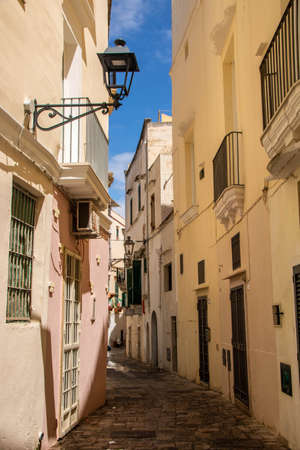 Isola Sant'Andrea Lighthouse, an active lighthouse located on Sant'Andrea island, at Gallipoli on the Ionian Sea, Apulia, Italyの写真素材
