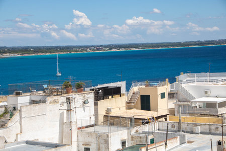 Isola Sant'Andrea Lighthouse, an active lighthouse located on Sant'Andrea island, at Gallipoli on the Ionian Sea, Apulia, Italyの写真素材