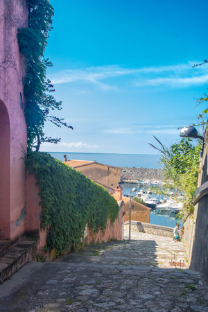 narrow street in the harbor of Maratea, Basilicata Italyの写真素材