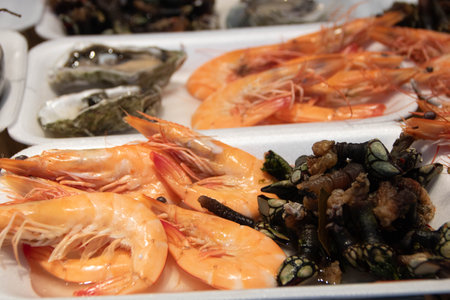 raw percebes and shrimps in the market of Bolhao in Porto