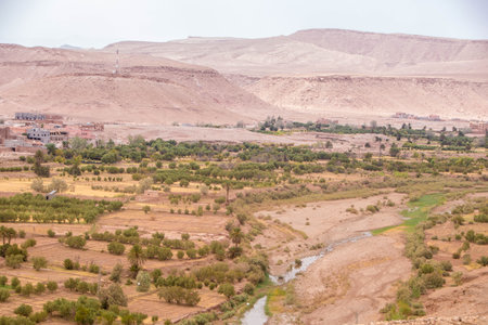 Landscape of desert and dunes as seen from the kasbah of Ait-Ben-Addou in Moroccoの写真素材