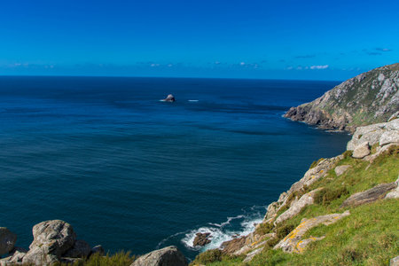 At Finisterre, Spain, On 03-01-25, The Lighthouse of Finisterre, the westernmost lighthouse in Europe standing atop the peak of Cape Finisterre, the Coast of Death.の写真素材