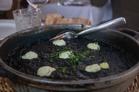 arroz negro or black paella made with squid ink, typical spanish recipeの写真素材