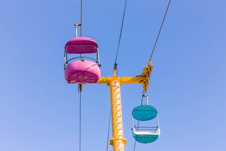Sky Glider Suspension Rides at Amusement Park at Santa Cruz Beach Boardwalk, Santa Cruz, California USAの写真素材