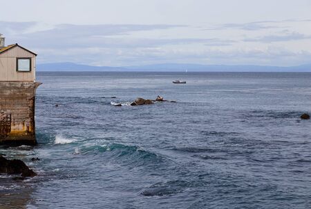 Pier on Cannery Row With View of Clouds and Monterey Bay, in Monterey, California, USAの写真素材